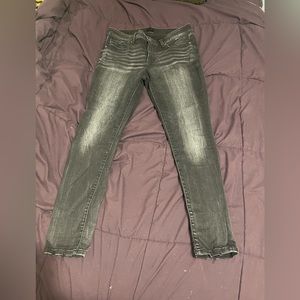 Buckle black skinny jeans